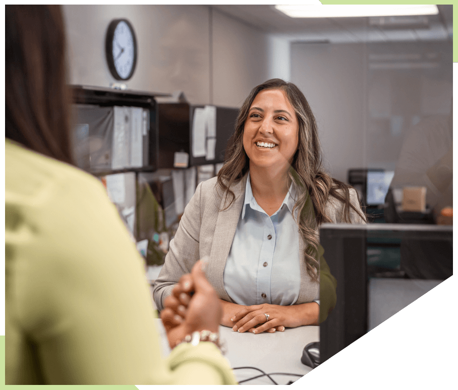 Female bank teller helping customer