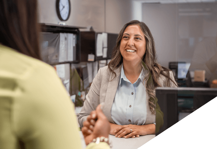 Female bank teller helping customer