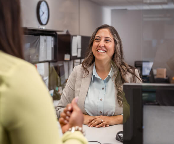 Female bank teller helping customer