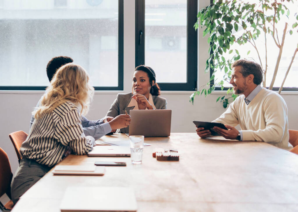 Group of employees sitting at a table