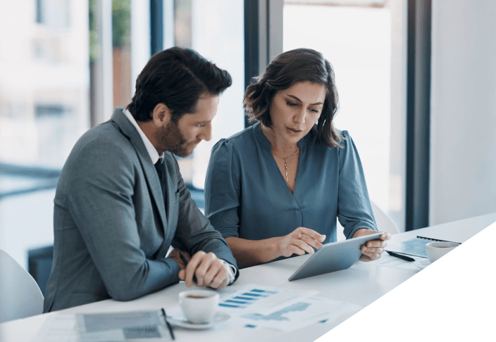 Man and woman business professionals reading data