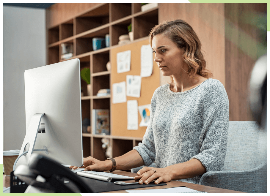 Woman using desktop computer in nice office