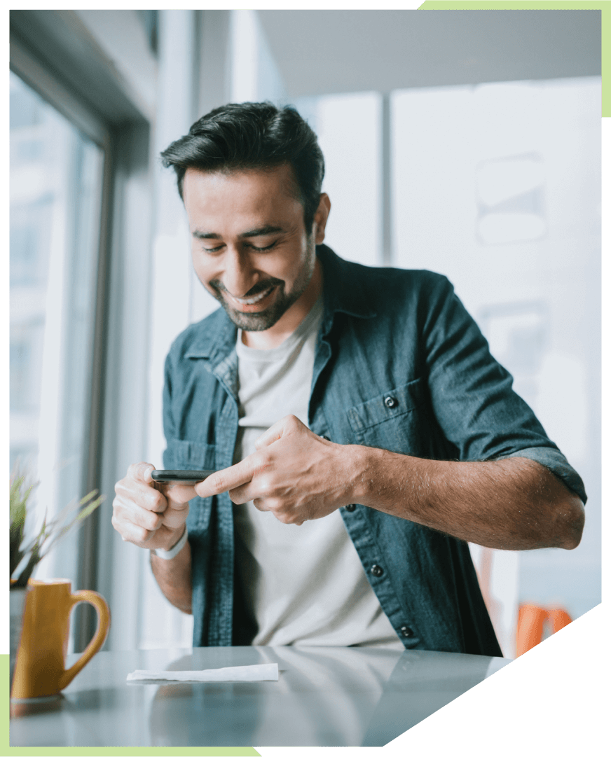 Man scanning check on kitchen table