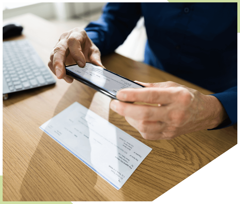 Man scanning check on table