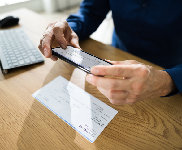 Man scanning check on table