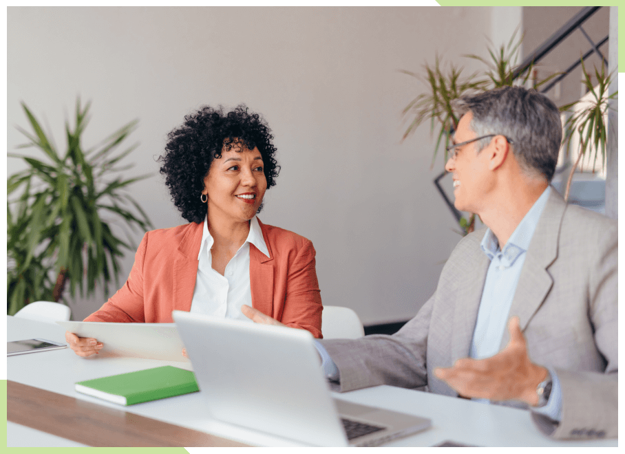 Man and woman talking at desk