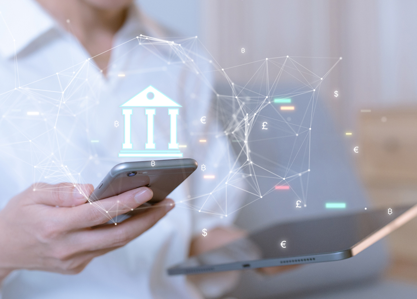 A woman holds a cellular phone in one hand and a tablet in the other. A schema with an icon of a bank shows above the devices indicating digital money movement.